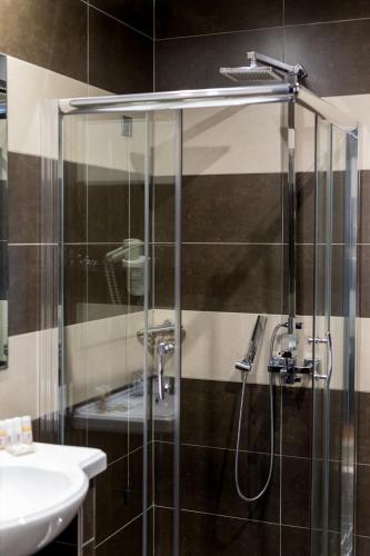 a bathroom with a shower and a sink at Areos in Athens