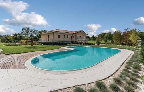 a large swimming pool in front of a house at Villa Giò in Pula