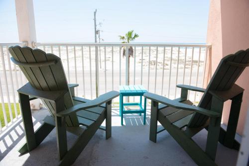 two chairs and a table on a balcony at Grand Beach Resort Unit 313 in Gulf Shores