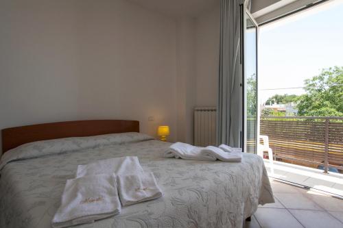 Postel nebo postele na pokoji v ubytování B&B Monelli