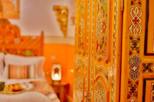 a close up of a bedroom door with a bed at Riad Las Mil y una Noches Tetuan in Tetouan