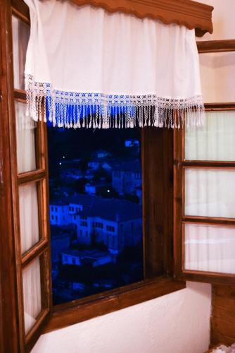 a window with a view of a city at Guest House Salaria in Gjirokastër