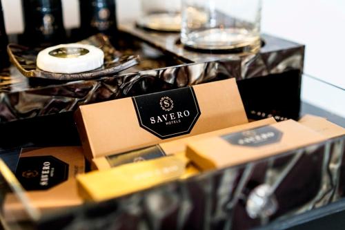 a table topped with boxes of food and drinks at Savero Hotel Depok in Depok