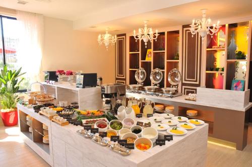a buffet line with a lot of food on it at Grand Park Hotel The Luxueux Minami Kashiwa in Kashiwa