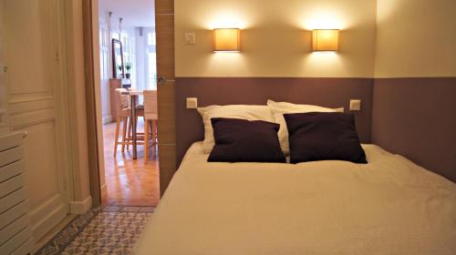 Giường trong phòng chung tại Little Suite - Antonin