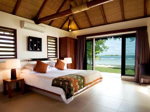 Postel nebo postele na pokoji v ubytování Eratap Beach Resort