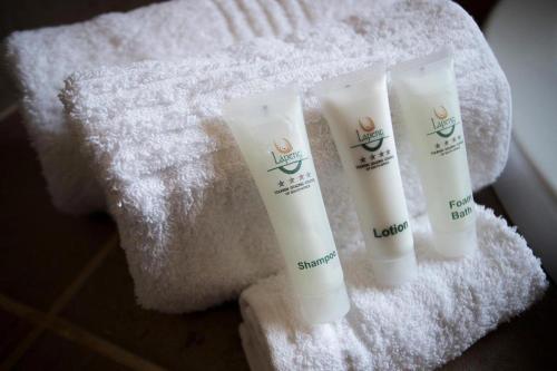 a group of three tubes of sunscreen on a towel at Lapeng Guest Lodge in Burgersfort
