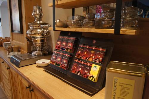 a counter top with a display of pots and pans at Wanderhotel Kirchner in Bramberg am Wildkogel