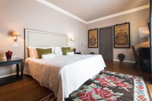 A bed or beds in a room at Hotel Michelangelo & Day SPA