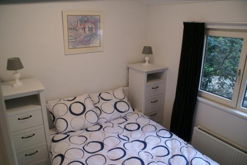 Кровать или кровати в номере t'Bakkersboschje nummer 11