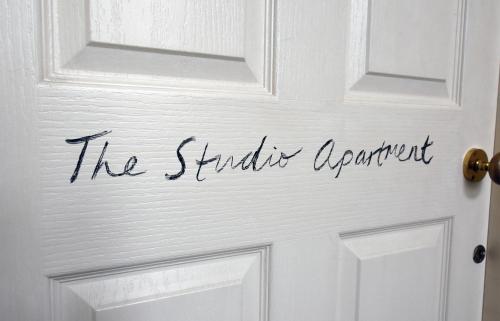 a sign on a door that reads the standards department at Dale Street Apartments Suite in Leamington Spa