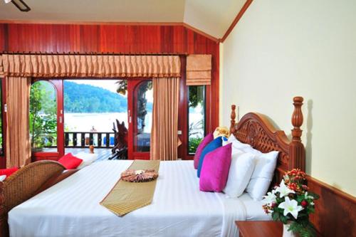 A bed or beds in a room at Haad Yao Bayview Resort & Spa - SHA plus Certified