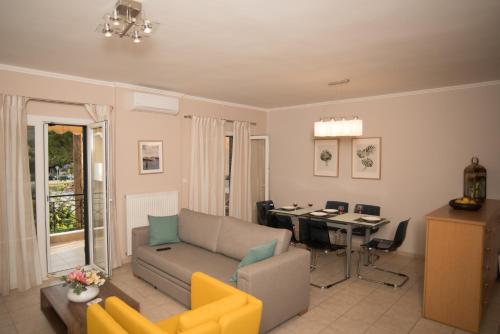a living room with a couch and a table at Mary's House in Lefkada Town