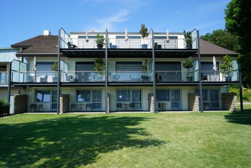 a large apartment building with a large yard at Köpfers Steinbuck in Bischoffingen