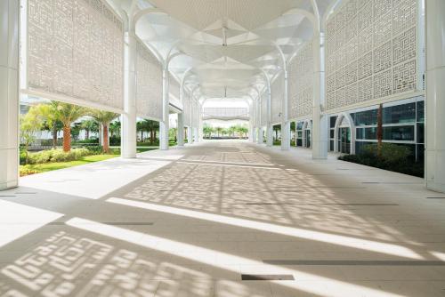 an empty hallway of a building with a white ceiling at Movenpick Hotel & Convention Centre KLIA in Sepang