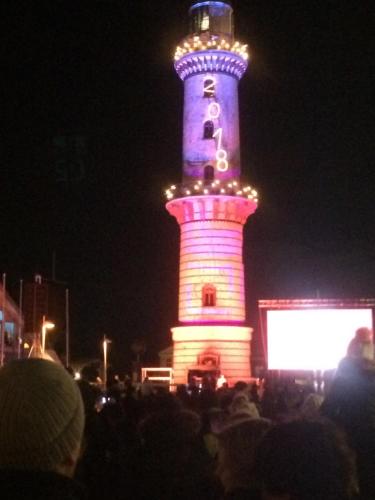 a large light tower with lights on it at night at Fewo31, exklusive Apartments, 2 Minuten vom Strand und Alten Strom in Warnemünde