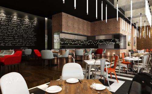 a restaurant with tables and chairs and a bar at Movenpick Hotel & Convention Centre KLIA in Sepang