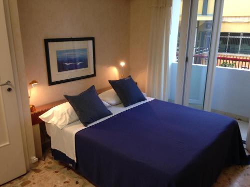Postel nebo postele na pokoji v ubytování Mare Nostrum Petit Hôtel