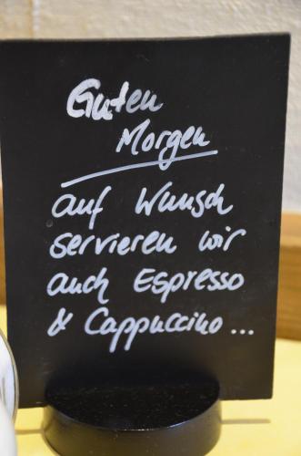 a black sign with white writing on it at Hotel Spessartstuben in Haibach