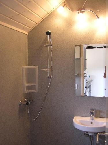 a bathroom with a shower and a sink at Nivå Camping & Cottages in Nivå