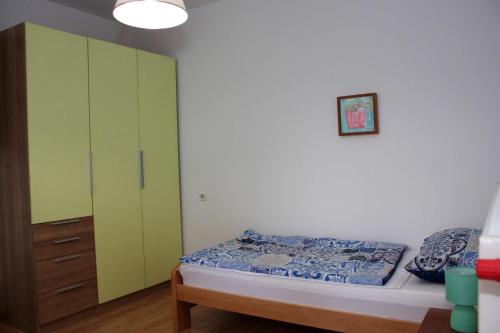Posteľ alebo postele v izbe v ubytovaní Apartmani Palmas Rijeka