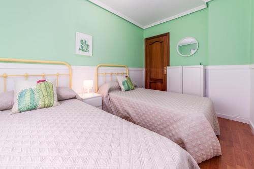 Ein Bett oder Betten in einem Zimmer der Unterkunft Travel Habitat Mestalla