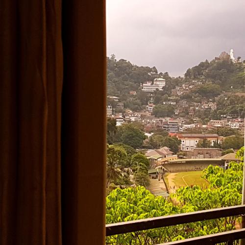 a view from a window of a city at Jaye's Homestay in Kandy