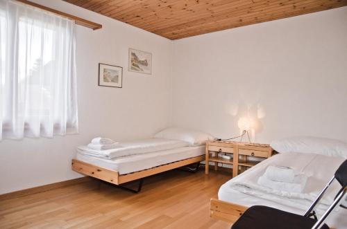 Postel nebo postele na pokoji v ubytování Apartment Aare 3.5 by GriwaRent AG