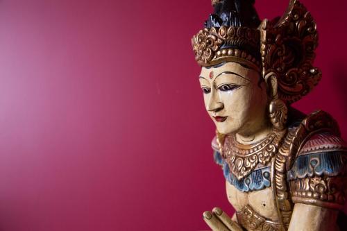 a statue of a woman with a crown on her head at St.Michaels Bistro in Painswick
