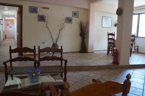 a living room with chairs and a table at Lemonies in Diakopto