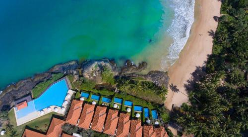 an aerial view of the beach and the ocean at Jetwing Saman Villas in Bentota