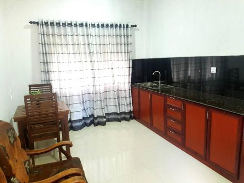 A kitchen or kitchenette at Sanithu Homestay Galle