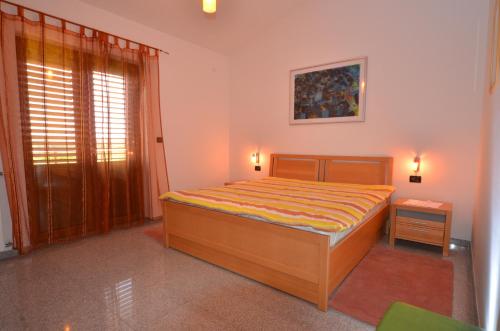 Postel nebo postele na pokoji v ubytování Apartments Ana Wellness
