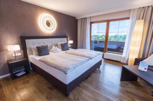 Postel nebo postele na pokoji v ubytování Der Birkenhof Spa & Genuss Resort