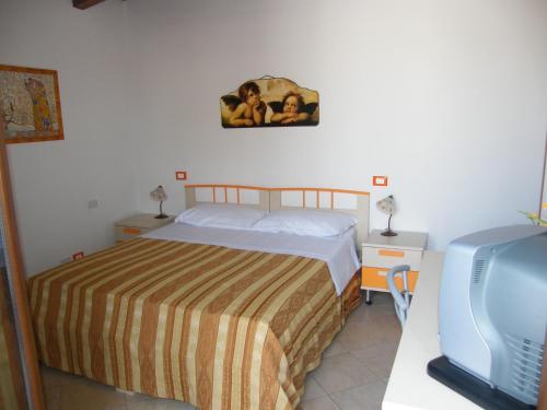 Posteľ alebo postele v izbe v ubytovaní Oasi del Sud