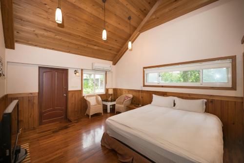 En eller flere senge i et værelse på Green Forest Villa