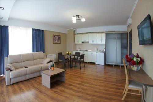 a living room with a couch and a table at Darya Hotel in Alushta