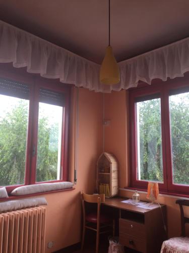 Ένα ή περισσότερα κρεβάτια σε δωμάτιο στο B&B Il tempo del sogno con cani e gatti Pet&Breakfast
