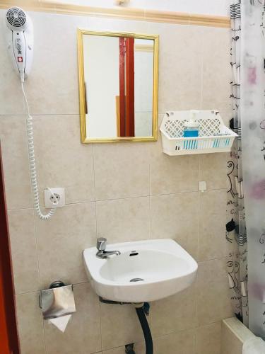 a bathroom with a sink and a mirror at H Juan in Marbella