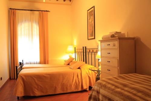 Postel nebo postele na pokoji v ubytování IL COLOMBAIO WINERY & Rooms