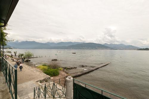 a view of a large body of water with mountains at Belvedere in Stresa