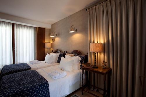 a hotel room with a bed and a window at Quinta do Monteverde in Viana do Castelo