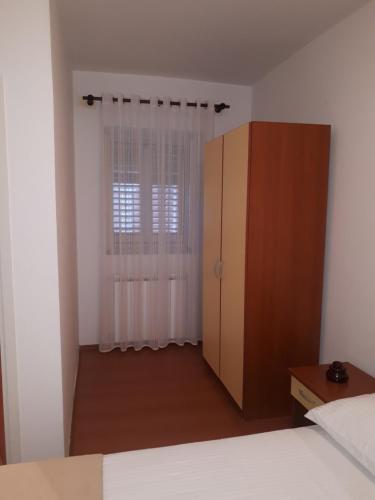 Postel nebo postele na pokoji v ubytování Apartments Tutina