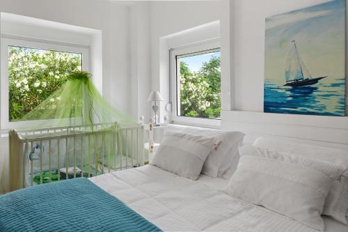 Una cama o camas en una habitación de Villa Elvina