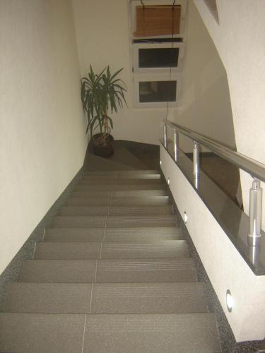 a staircase in a building with a potted plant at Ana Marija in Solin