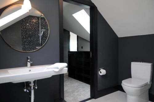 a bathroom with a sink and a mirror at Seascapes in Inch