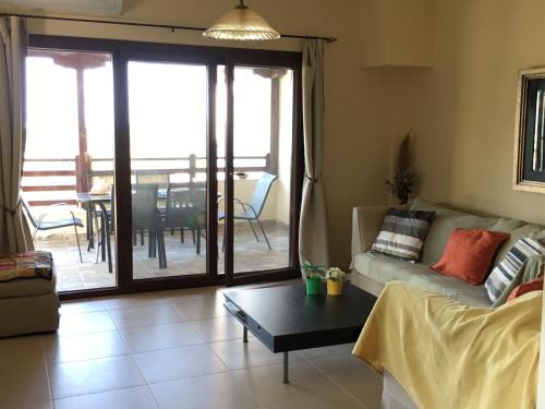 a living room with a couch and a table at Athinaios Porto Klisouri Villa in Ierissos
