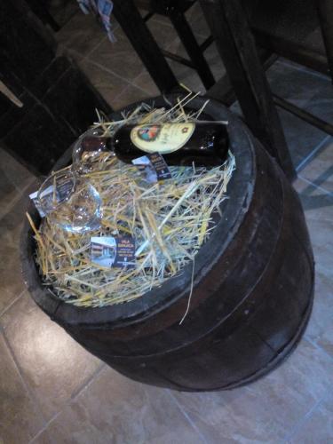 a spare tire with a bottle of wine in it at Guest House Vila Banjica in Pirot