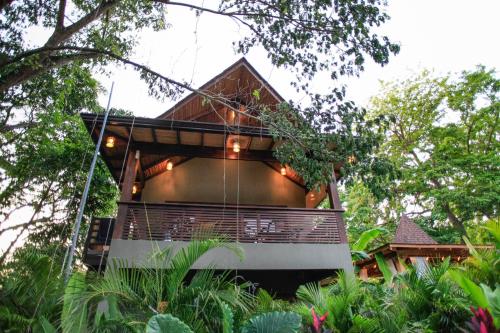 a tree house in the middle of a forest at Lua Villas in Santa Teresa Beach