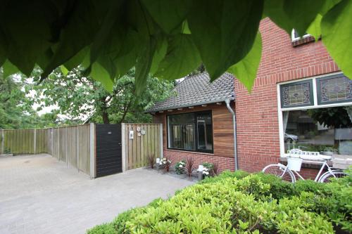 a patio area with a patio table and patio furniture at B & B Chawe in Enschede